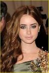 http://cdn.buzznet.com/media/jjr/2010/05/lily-collins-costume/lily-collins-costume-gala-02.jpg