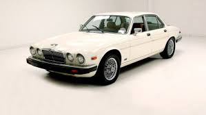 Image result for Nimbus White 1987 Jaguar