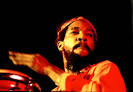 Black bongo player performs at