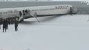 Delta flight skids off LaGuardia runway, stops feet from frigid.