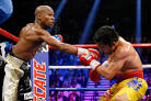 Floyd Mayweather Jr. Defeats Manny Pacquiao in Boxings Big Mat.