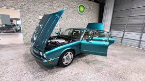 Image result for Bright Turquoise 1995 Jaguar