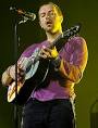 Image Chris Martin playing the guitar during Coldplays Viva la Vida Tour in  08. Picture