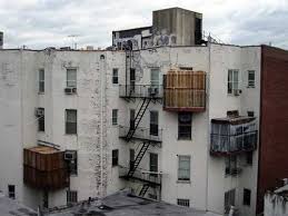 Three sukkot on balconies