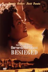 an African refugee whose husband is a political prisoner in Africa. The pianist becomes smitten with her and winds up pawning or selling everything he owns [including his most precious possession, a Steinway grand piano] in order to help get her husband out of jail.