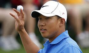 Anthony Kim holds up the ball