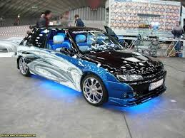 http://t0.gstatic.com/images?q=tbn:yKpoX3OLnpNM7M:http://timoungwada.unblog.fr/files/2009/07/306tuning.jpg