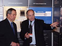 The Executive Director of the UNEP (left) is talking with Dr. Rudolf Henne (right) about the projects in ...