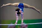Malaysias FARAH ANN Abdul Hadi competes on the uneven bars during.