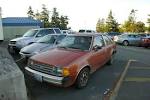 OLD PARKED CARS.: 1983 Ford Escort.