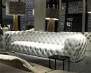White tufted leather sofa by Baxter