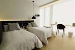 modern bedroom with cozy twin beds in white bed cover, hanging ...