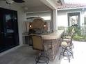 Weber Barbecue Grill Built Into Custom Outdoor Kitchen and Bar Area.
