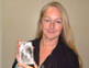 Christine Finn holding a photograph of herself when three years old, ... - ds_gal_christine-thumb