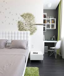 simple-modern-neutral-toned-bedroom-with-gray-bedcover-and-dandelion-painting-on-the-wall-and-also-green-layer-rugs-and-white-cabinet-on-dark-hardwood-floor ...