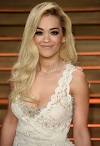 Rita Ora swaps super-short hair for long extensions at Oscars.