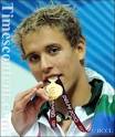 Chad Guy Dertrand Le Clos of South Africa celebrates on the podium after ... - Dertrand-Le-Clos