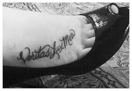 inscription on the foot tattoo