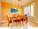 Orange Dining Room With Wood Table And Hardwood Floor. Stock Photo ...