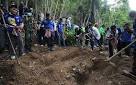 Mass graves discovered in Malaysian migrant trafficking camps.