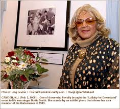 Dreamland-era singer Dottie Smith stands by an exhibit photo that shows her as a member of the Harlemaires in 1949. See larger photo. - ccnews130_03_big