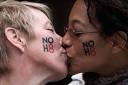 Lori Campbell (L) and Maja Roble, who are engaged, kiss at a celebration ... - gay_kiss-460x307