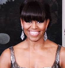 ... were greeted with an award ourselves: Michele Obama&#39;s telecast appearance wearing a “wake up” glam gown and some killer vintage Harry Winston earrings. - michelle-obama-oscars-2013-gi