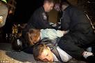 Occupy Boston: Police arrest 100 protesters and 'throw their tents ...