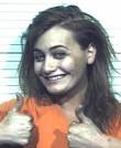Michelle Watson gives 2 thumbs-up in mugshot after she's charged ...