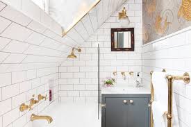 Light-colored tiles and fixtures in tiny bathroom