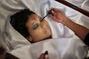 Marta Reyes applies makeup ... - 67-12-03-AbdR-A-01