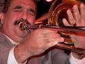 ... Page has links to photographs and MPG Salsa Video Clips of Willie Colon. - 49427