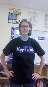 Jessica Dilling displays the shirt worn by key clubbers at events around the school and community. - Dilling