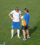 File:Katie Schoepfer talking pre game with head coach Lisa Cole