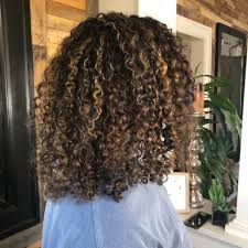 Brown highlights on curly hair