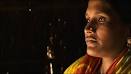Nargis Begum is due to give birth during the floods, a prospect she finds ... - _46033571_mother512