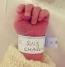 Poignant Je Suis Charlie baby picture shows new life on a day of.