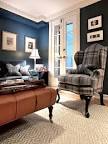 Transitional Living Room With Blue Walls, Leather Ottoman & Plaid ...