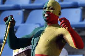 body-painted Benin fan cheers from the crowd - but he can't help as his