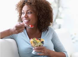 black-woman-eating-fruit-