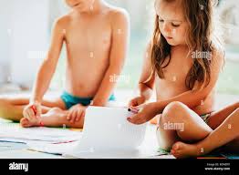 young little naked kid boys an girls|Little boy and girl drawing with crayons Stock Photo - Alamy