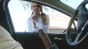 Redhead sexpot gives a head while boyfriend rides a car video jpg x Redhead blowjob car