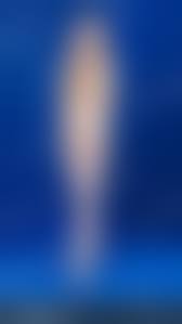 standing naked|Young man standing naked, holding back stock photo