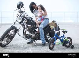 daugther sit and riding|Child sit in rider saddle on animal back — Stock Photo © Tverdohlib.com  #220693606