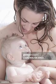  little girl naked |Young Dad Holds An D Looks At Naked Baby Girl On Vacation At Beach  Photograph by Cavan Images - Fine Art America