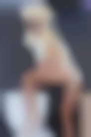 Lady gaga arrives in just a thong and sea shell bra at athens airport png x Lady gaga