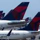 Delta: 'Large-scale cancellations' after crippling power outage 