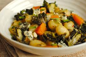 Homemade potato gnocchi with gorgonzola and walnut sauce gnocchi gorgonzola e noci feature plated with fork jpg x To pronounce gnocchi