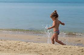 nudist little girl|Shutterstock