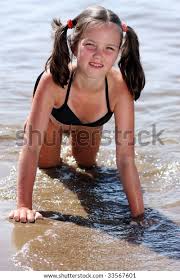 nudist little girl|The child, a little girl playing on the beach. Stock 写真 ...